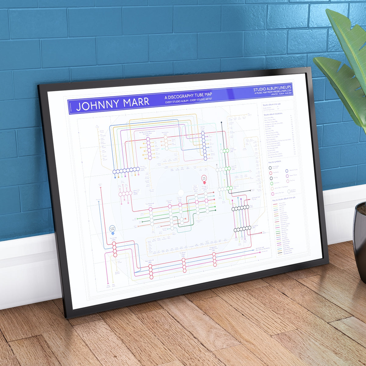Ideal gift for Johnny Marr fans - discography map wall art print in an A1 landscape frame, hung on a feature wall, showing the studio albums in order across Marr&