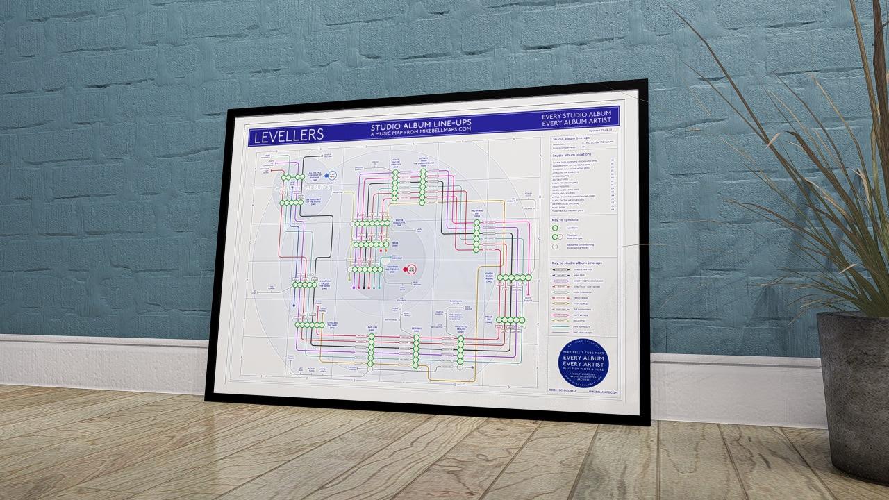 Levellers discography map wall art print in a black A1 landscape frame, hung on a feature wall, showing every studio album in order, designed by Mike Bell at mikebellmaps.com.