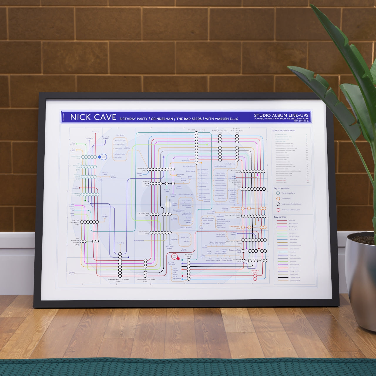 Ideal gift for Nick Cave fans - A1 framed Giclée discography tube map hung on a feature wall, showing every studio album from Door, Door (1979) through The Birthday Party, the Bad Seeds and Grinderman to Wild God (2024). Designed by Mike Bell at mikebellmaps.com.