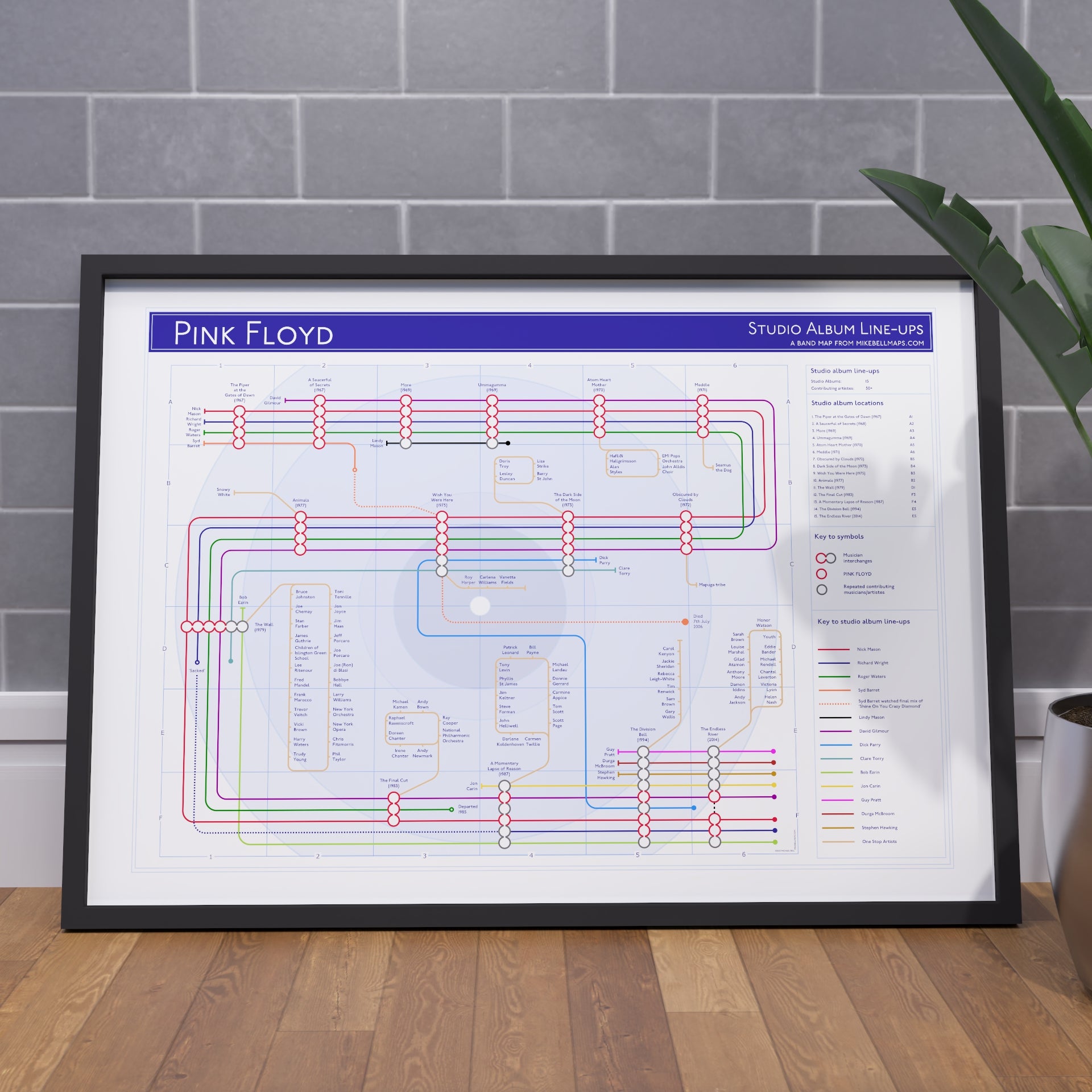Pink Floyd discography map wall art print in a black A1 landscape frame, hung on a feature wall, showing every studio album in order, designed by Mike Bell at mikebellmaps.com.