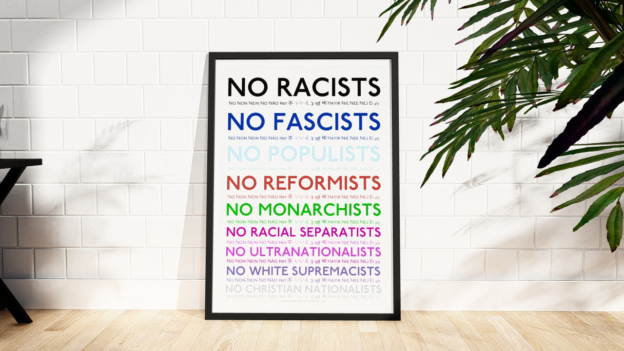 Framed Art Print with anti-racism and anti-fascism statements on a white wall.