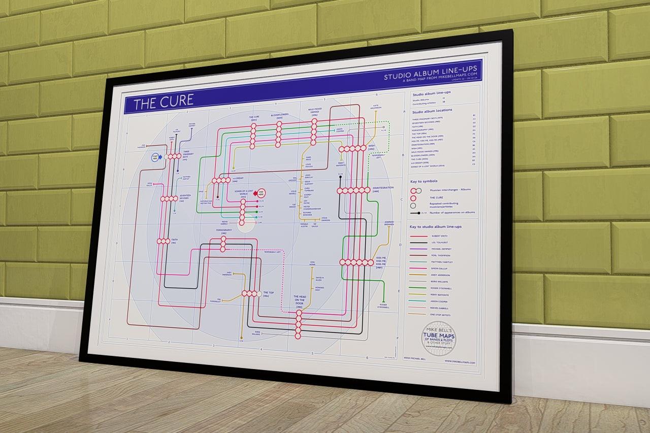 The Cure discography map wall art print in a black A1 landscape frame, hung on a feature wall, showing every studio album in order, designed by Mike Bell at mikebellmaps.com.