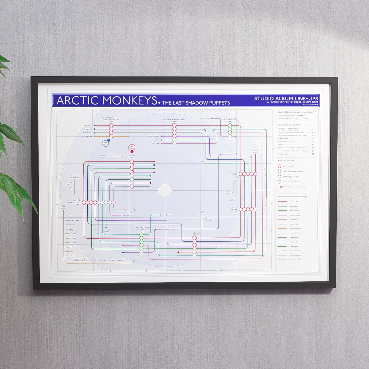 Ideal gift for Arctic Monkeys fans - A1 framed Giclée discography tube map hung on a wall, showing every studio album from Whatever People Say I Am (2006) to The Car (2022), designed by Mike Bell at mikebellmaps.com.