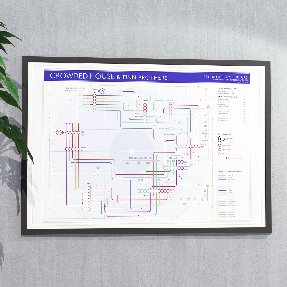 Ideal gift for Crowded House fans - A1 framed Giclée discography tube map hung on a wall, showing the studio albums in order, designed by Mike Bell at mikebellmaps.com.
