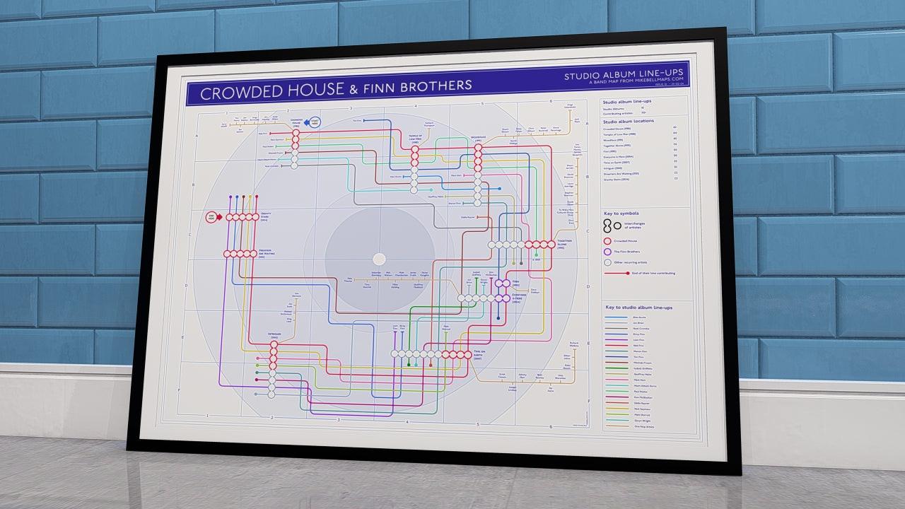 Crowded House discography map wall art print in a black A1 landscape frame, hung on a feature wall, showing every studio album in order, designed by Mike Bell at mikebellmaps.com.