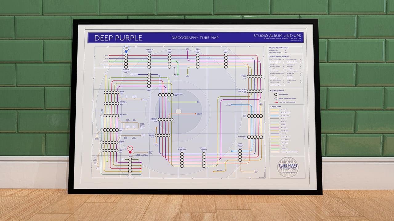 Deep Purple discography map wall art print in a black A1 landscape frame, hung on a feature wall, showing every studio album in order across every Mark line-up, designed by Mike Bell at mikebellmaps.com.