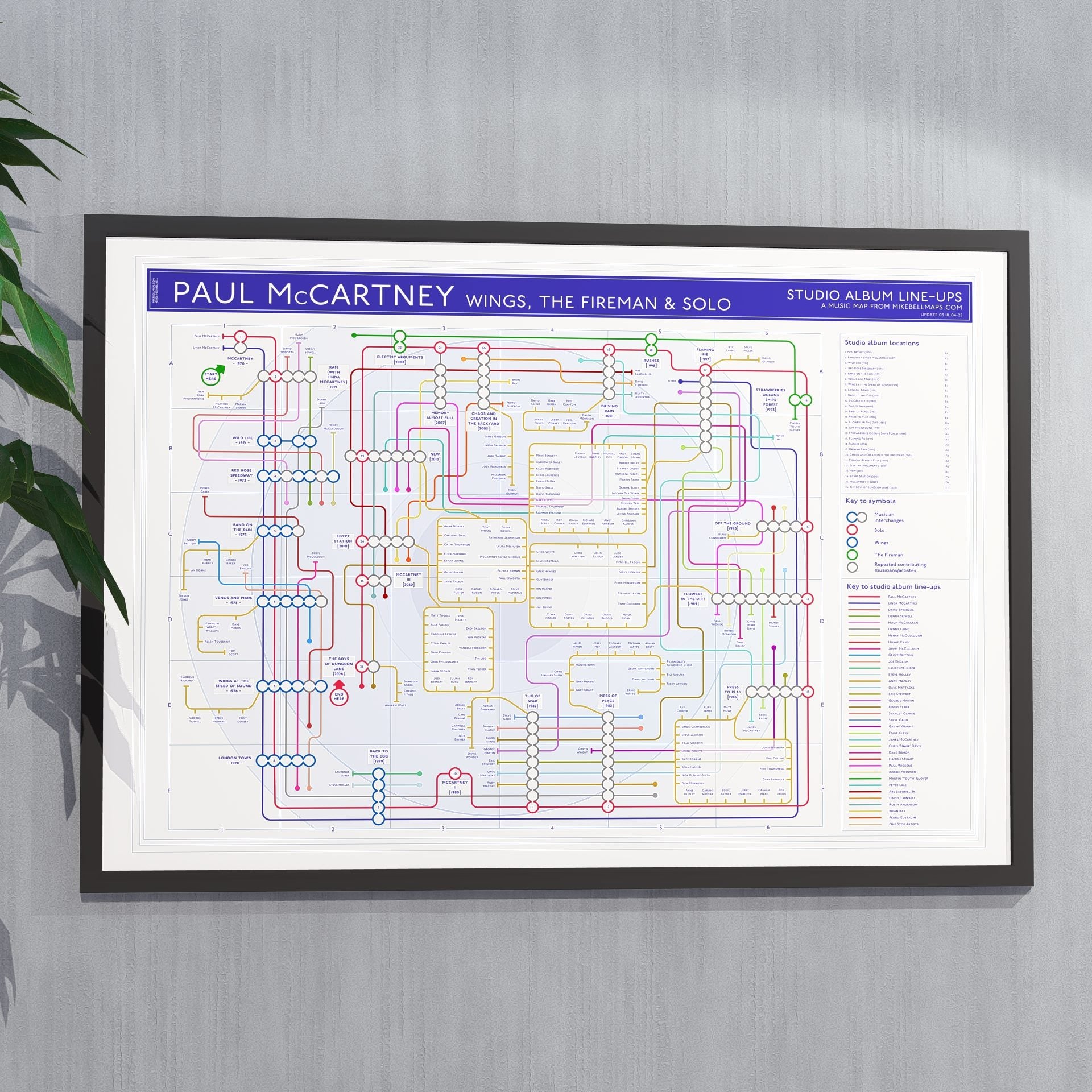 Ideal gift for Paul McCartney fans - A1 framed Giclée discography tube map hung on a feature wall, covering Wings, The Fireman and solo albums, designed by Mike Bell at mikebellmaps.com.