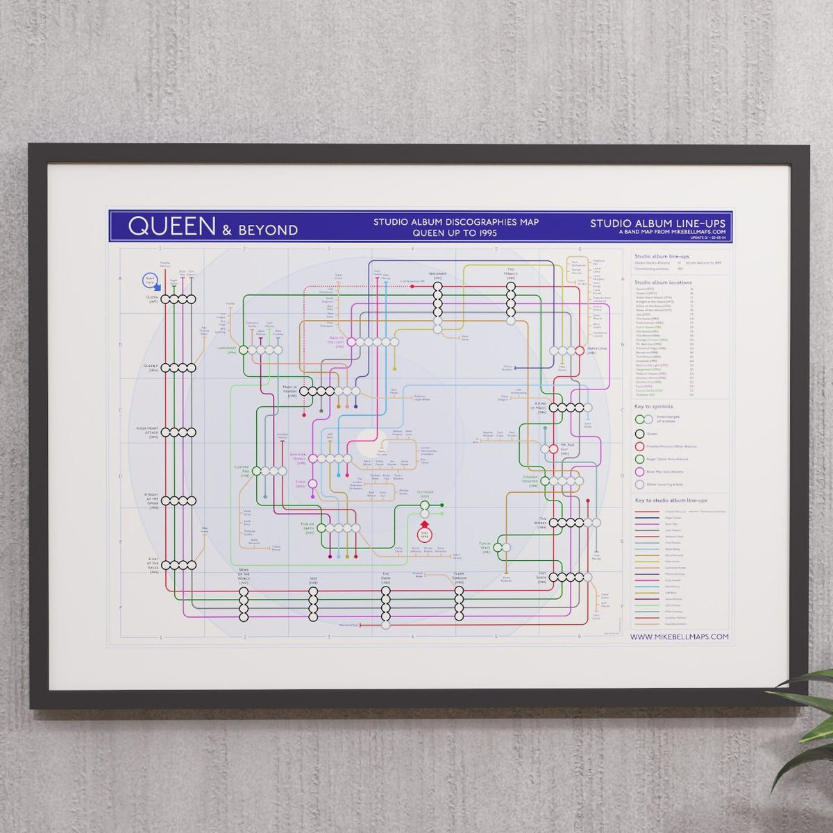 Queen discography tube map in A2 (594 x 420 mm), framed Giclée wall art print in a black wooden frame, designed by Mike Bell.