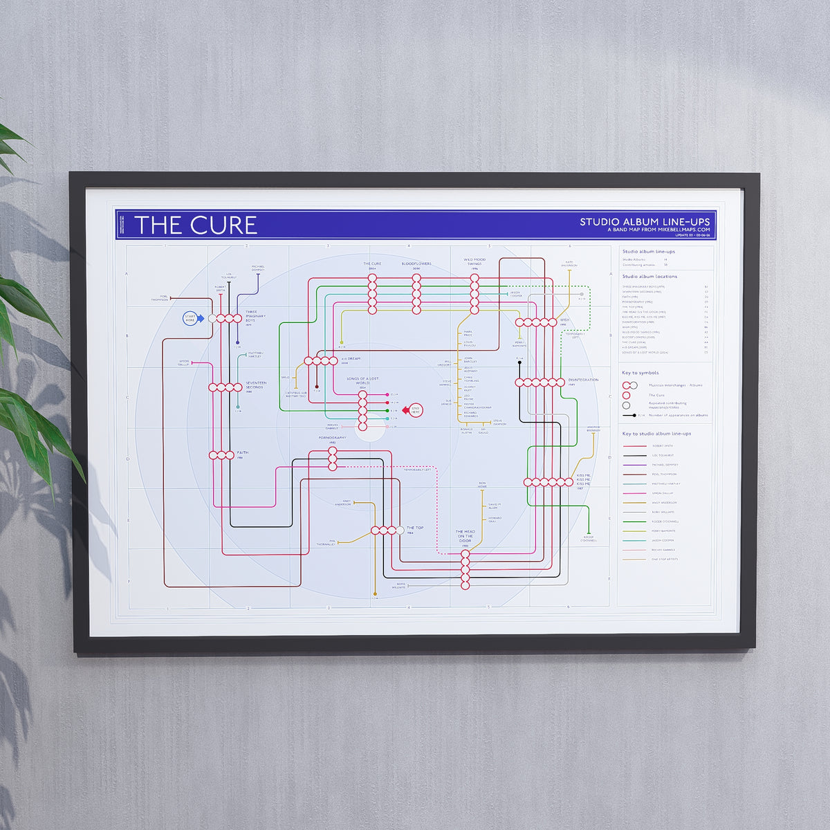 The Cure discography tube map in A1 (841 x 594 mm), framed Giclée wall art print hung in a black wooden frame showing the complete studio album sequence, by Mike Bell.