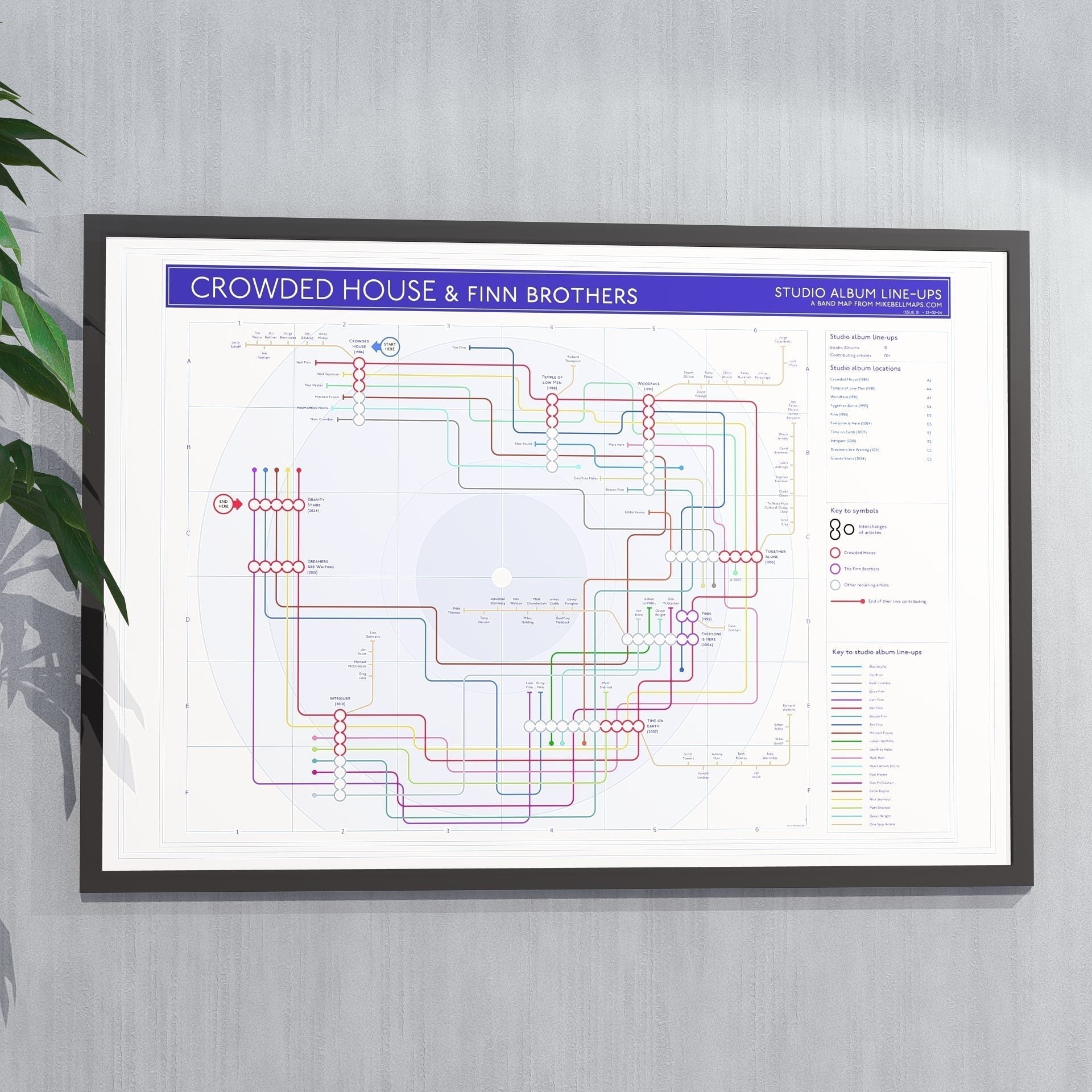 Gift for Crowded House fans - A1 framed Giclée discography tube map art print hung on a wall, showing every studio album as a station and every credited musician as a tube line, designed by Mike Bell.