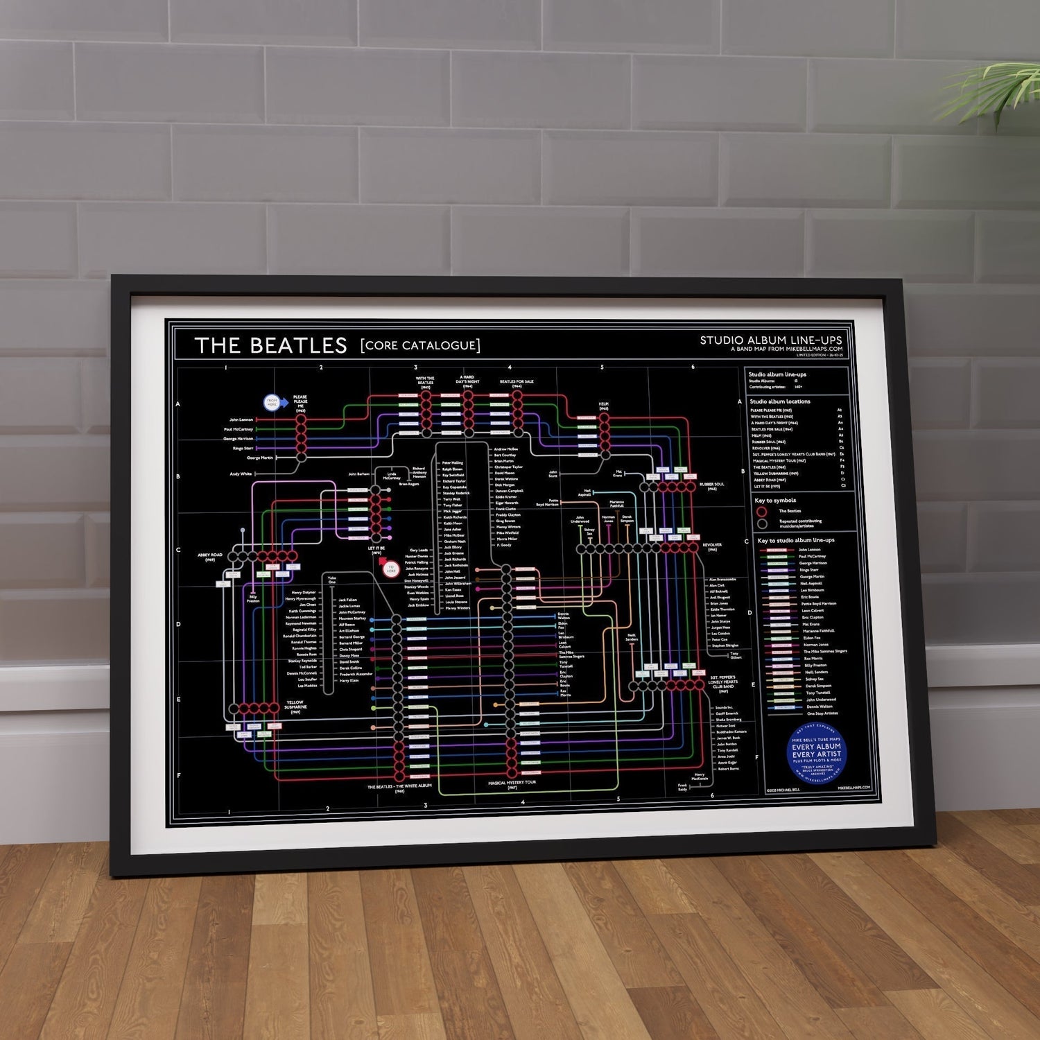The Beatles (Black) discography tube map wall art print in an A2 black frame, an ideal gift for die-hard music fans, designed by Mike Bell.