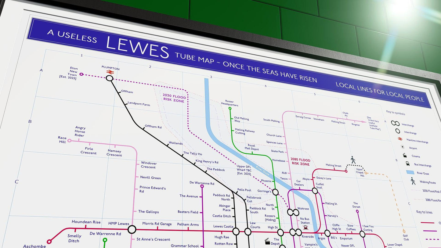 Wall-mounted framed print of a Lewes transport map, reimagined with future extensions and flood risks.