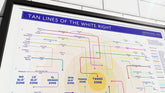 Wall-mounted framed poster of "Tan Lines of the White Right," a parody map illustrating tanning stereotypes among right-wing politicians and media figures.