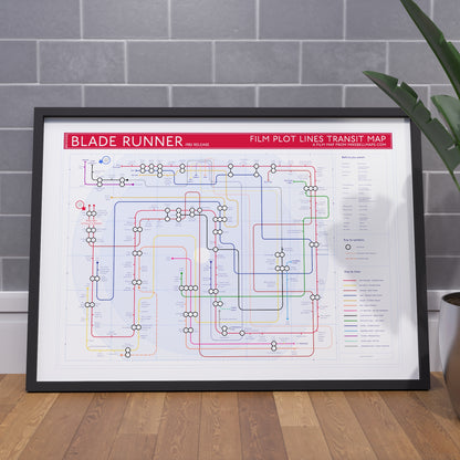 Framed art print gift for Blade Runner fans - the Blade Runner plot map in A1 size, framed Giclée wall art print propped against a wall on the floor, by Mike Bell.