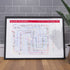 Framed art print gift for Blade Runner fans - the Blade Runner plot map in A1 size, framed Giclée wall art print propped against a wall on the floor, by Mike Bell.