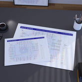 Two David Bowie studio album discography maps on a desk with a cup of coffee and office supplies.