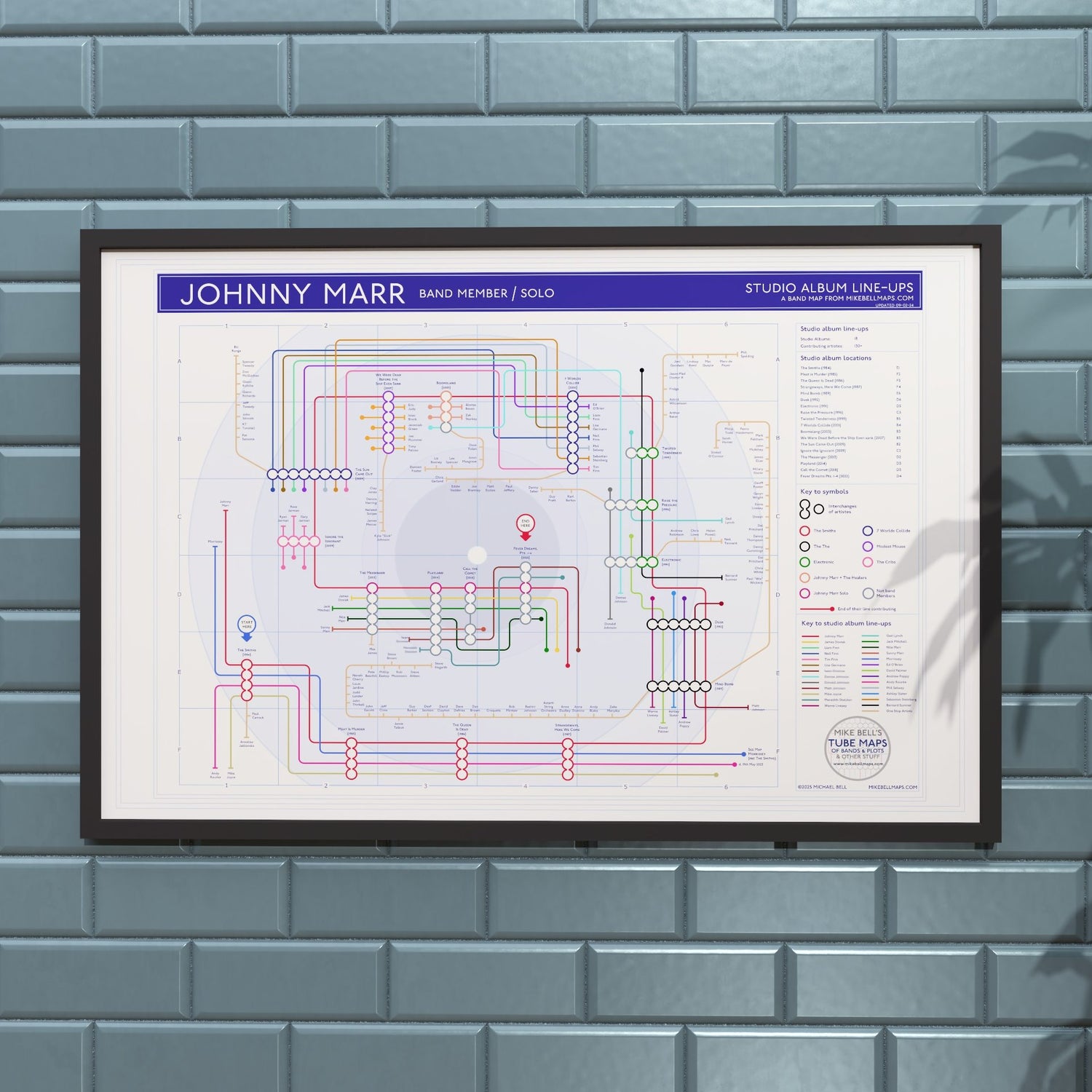 Johnny Marr discography map in 36x24in, framed Giclée wall art print hung on a wall, showing the Smiths, Electronic, The The and solo lines, designed by Mike Bell.