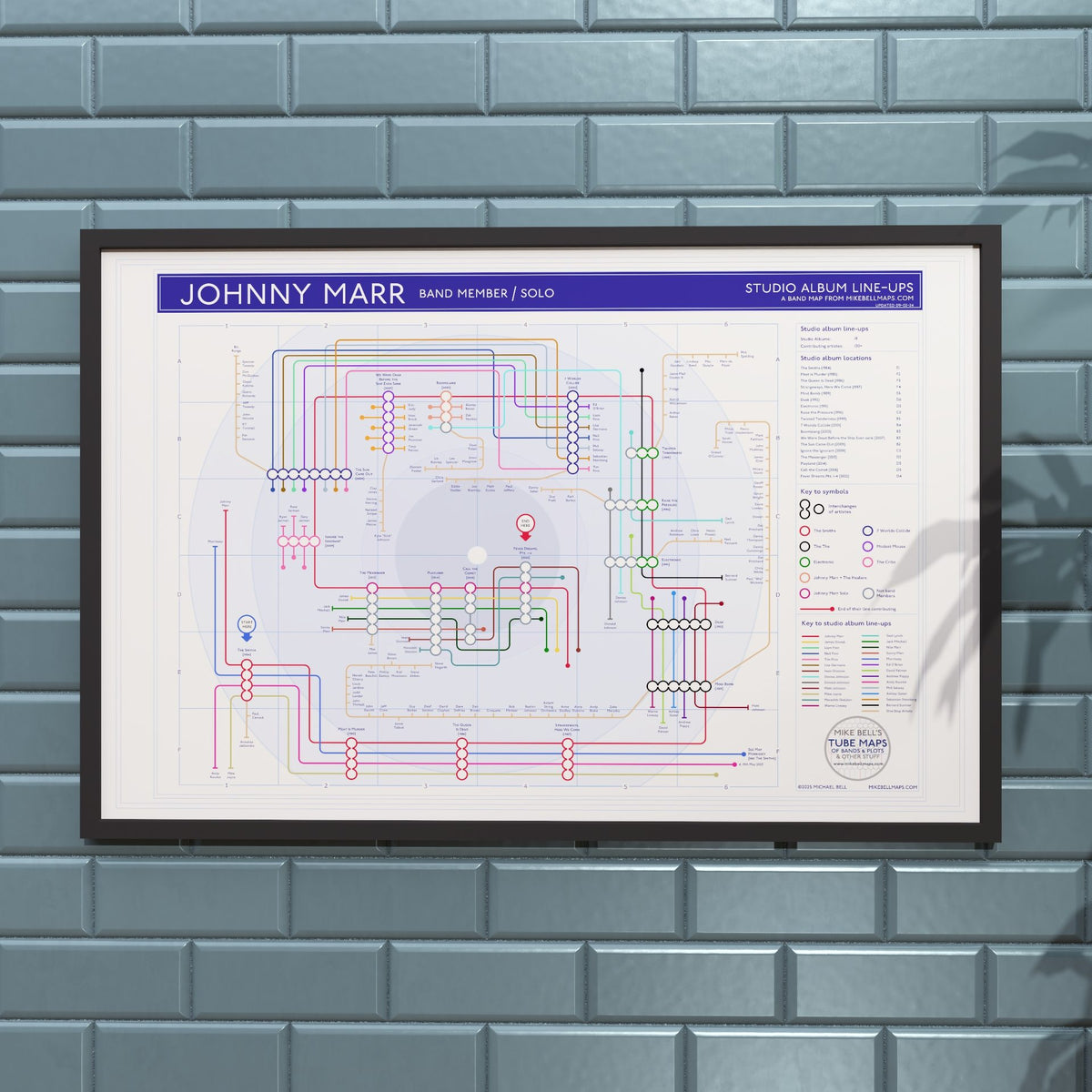 Johnny Marr discography map in 36x24in, framed Giclée wall art print hung on a wall, showing the Smiths, Electronic, The The and solo lines, designed by Mike Bell.