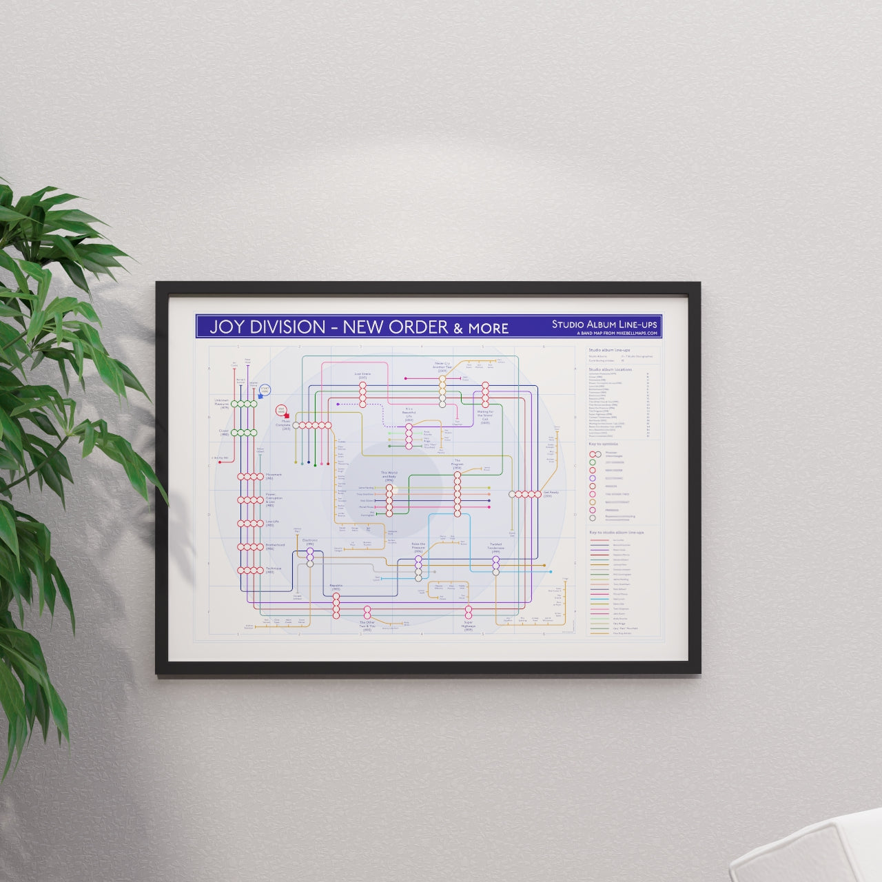 Joy Division and New Order combined discography tube map in A1 size, framed Giclée wall art print in black handmade Italian solid wood frame by Mike Bell.