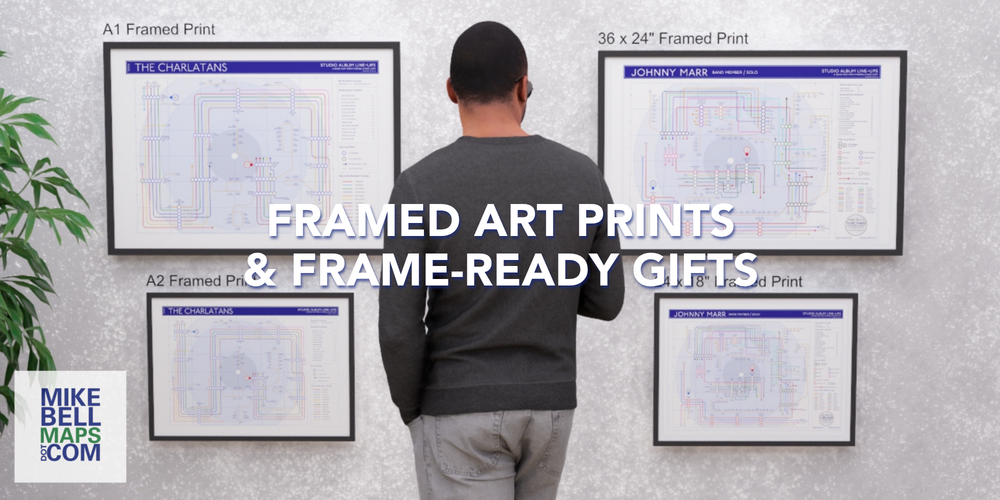 Man looking at framed art prints on a wall with promotional text for Mike Bell Maps.