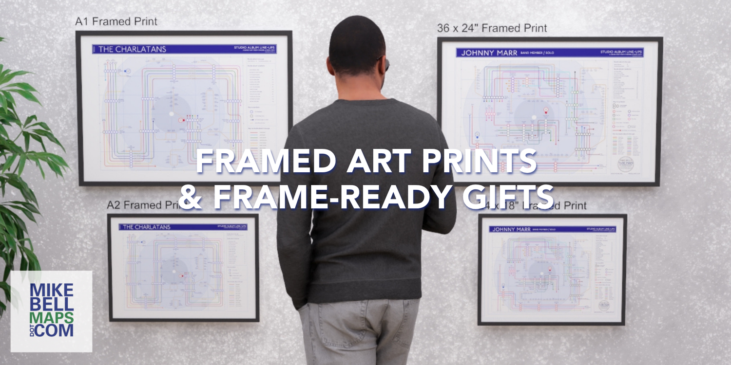 Man looking at framed art prints on a wall with promotional text for Mike Bell Maps.