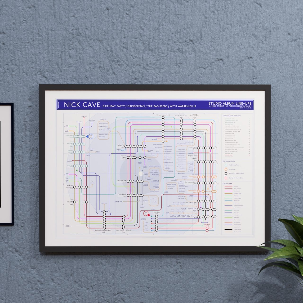 Music wall art gift for Cave and Bad Seeds fans - A2 framed Giclée discography tube map hung on a wall, showing Warren Ellis&