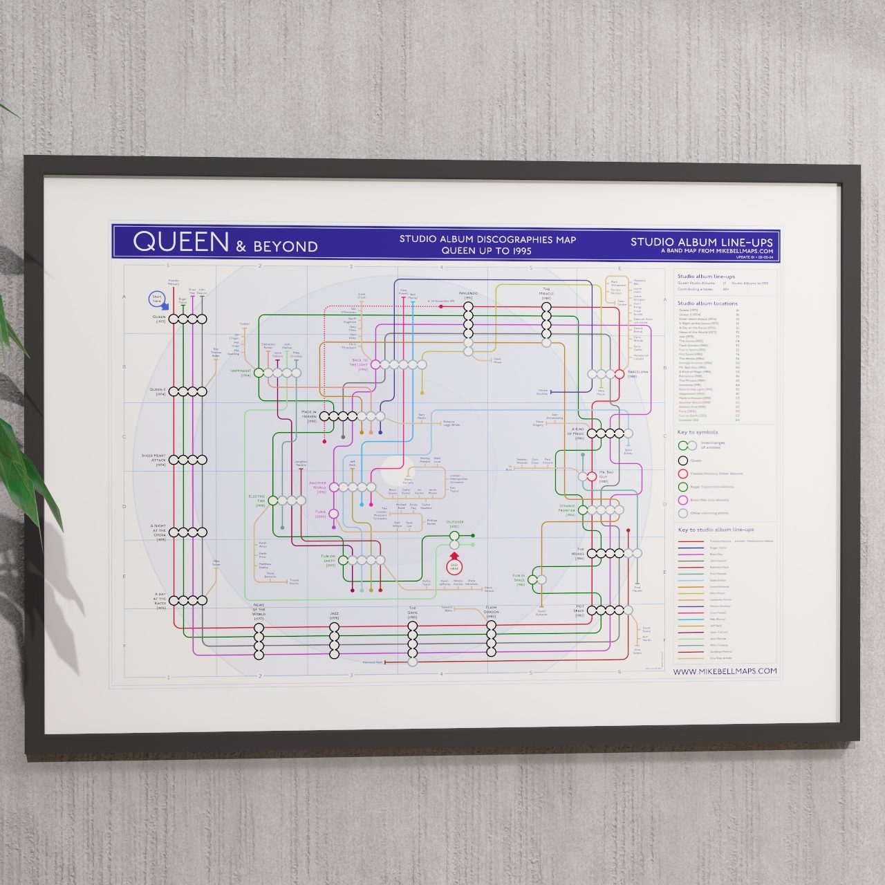 Ideal gift for Queen fans - A1 framed Giclée discography tube map hung on a wall, designed by Mike Bell.